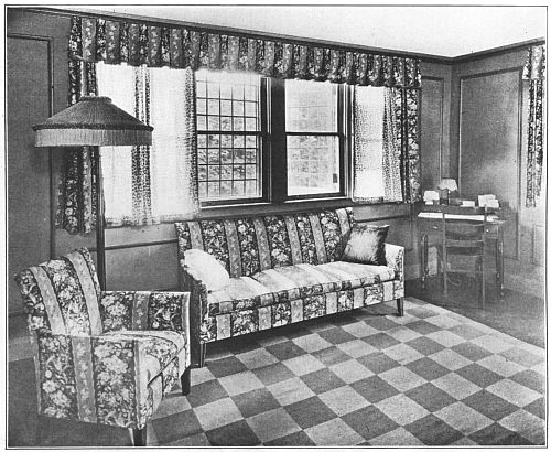 GROUPED WINDOWS WITH SQUARE PANES, LACE GLASS CURTAINS AND CRETONNE OVER CURTAINS