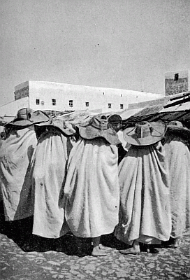 A CLUSTER OF COUNTRY WOMEN.