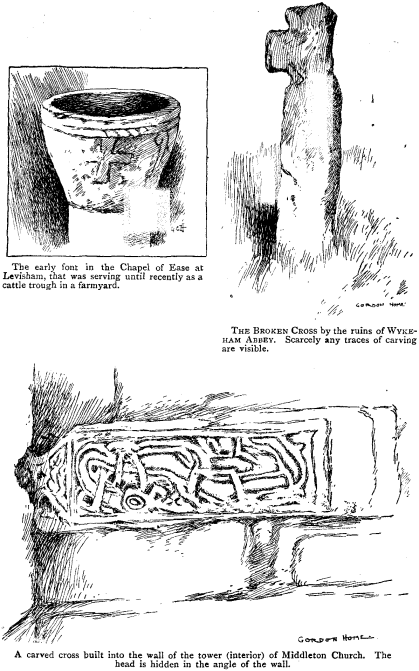  The early font in the Chapel of Ease at Levisham, that was serving only recently as a cattle trough in a farmyard. The BROKEN CROSS by the ruins of WYKEHAM ABBEY. Scarcely any traces of carving are visible. A carved cross built into the wall of the tower (interior) of Middleton Church. The head is hidden in the angle of the wall. 