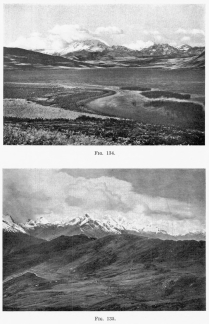 Fig. 134—Southwestern aspect of the Cordillera
Vilcapampa between Anta and Urubamba from Lake Huaipo. Rugged summit
topography in the background, graded post-mature slopes in the middle
distance, and solution lake in limestone in the foreground.