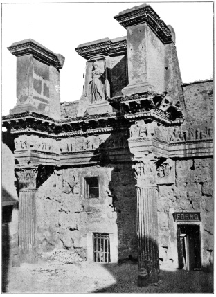 PART OF THE BOUNDING WALL OF THE FORUM OF NERVA (FORUM
TRANSITORIUM) ROME: THE MODERN LEVEL AT LEAST TWENTY FEET ABOVE
ANCIENT PAVEMENT.
