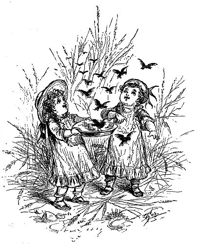 two children feeding birds